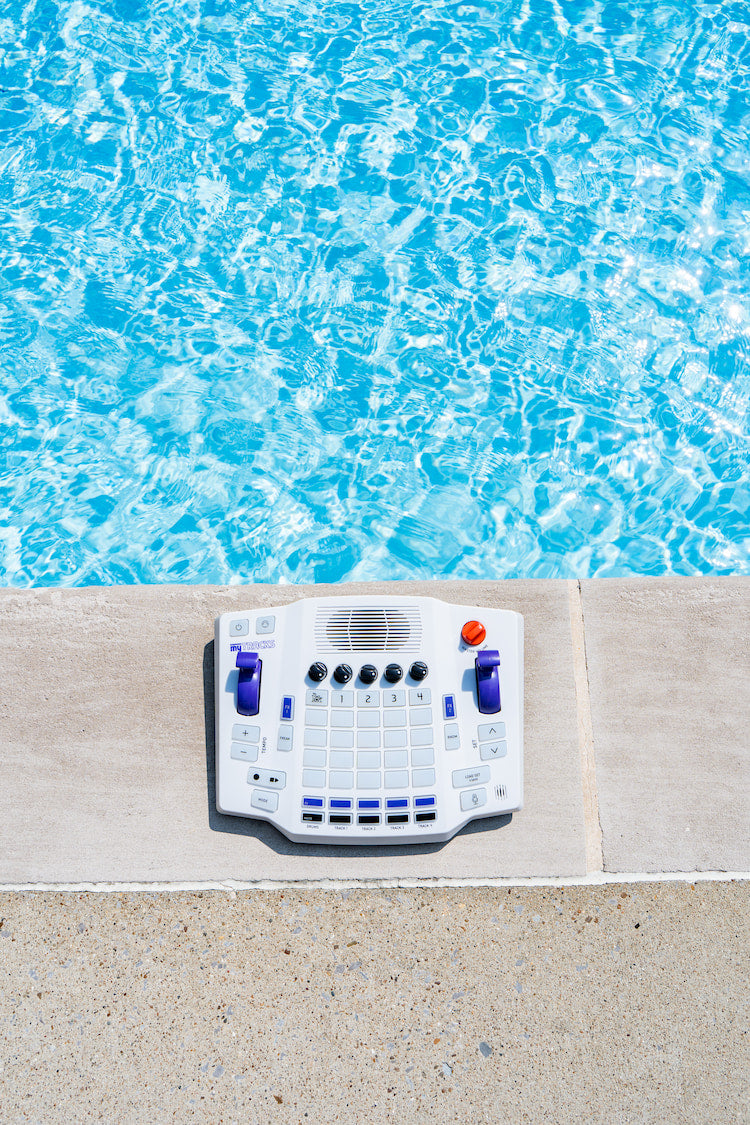 Blipblox myTRACKS on pool deck with blue water in background