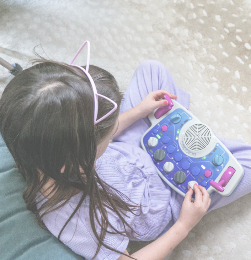 Child playing with a Blipblox SK2 on the floor