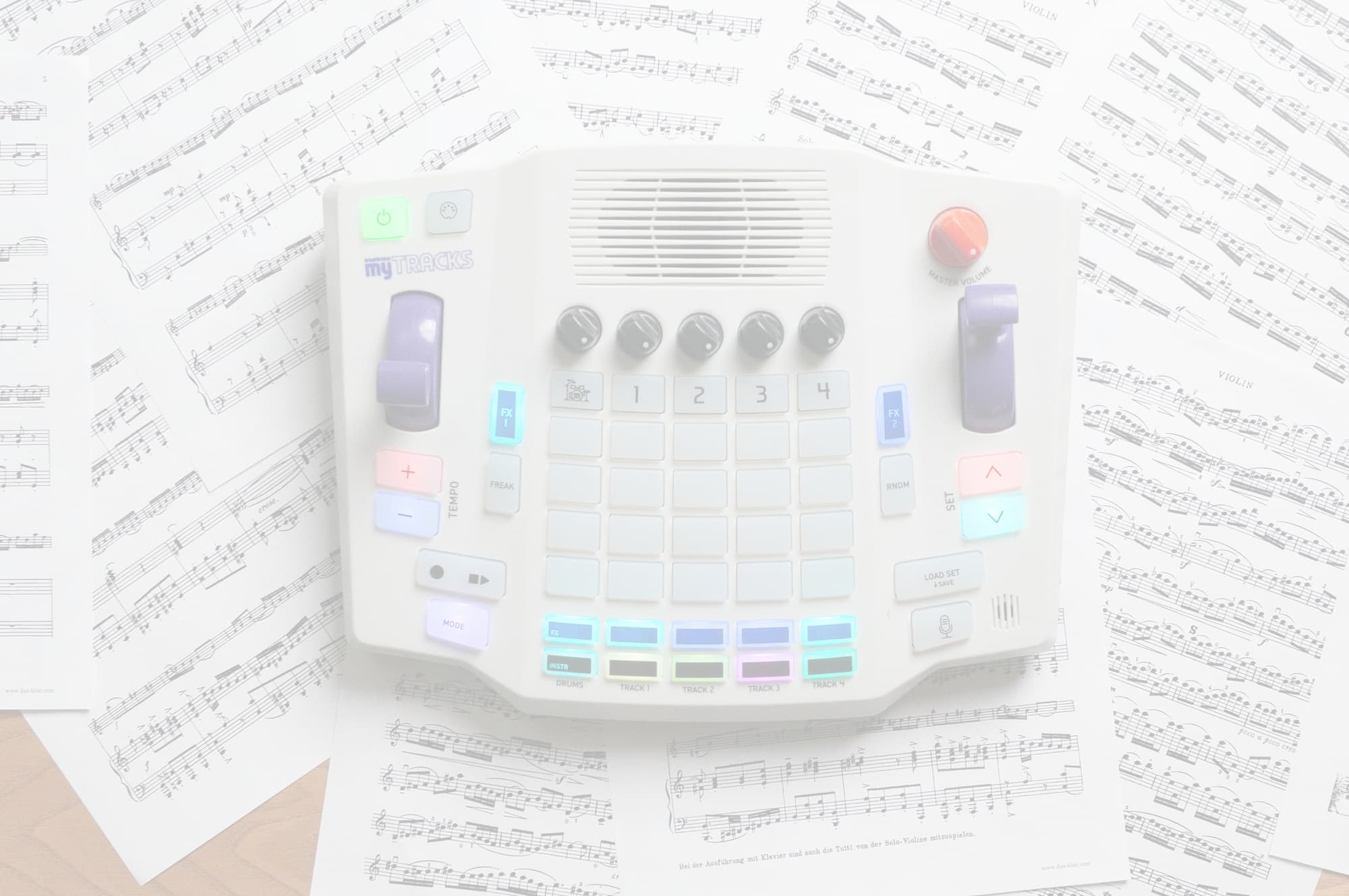 Blipblox myTRACKS electronic music toy resting on classical sheet music