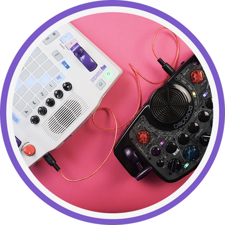 One myTRACKS and one After Dark on a pink surface with a purple border